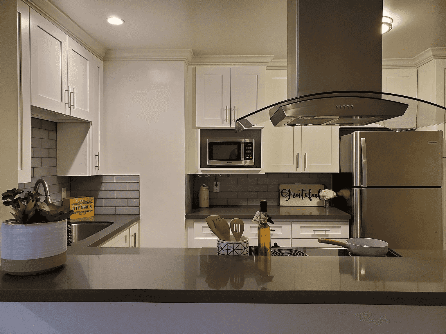 renovated kitchen with quartz breakfast bar