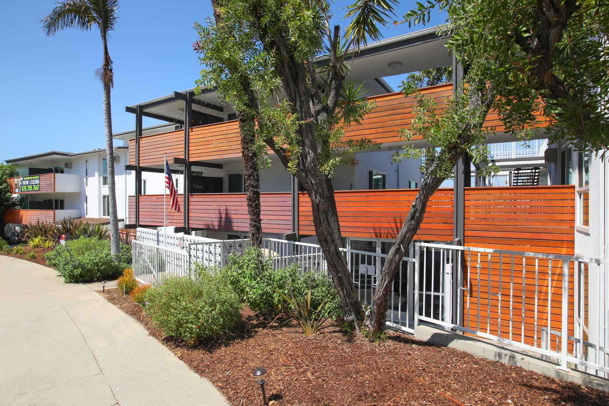 Amberwood modern exterior with wood accent balconies