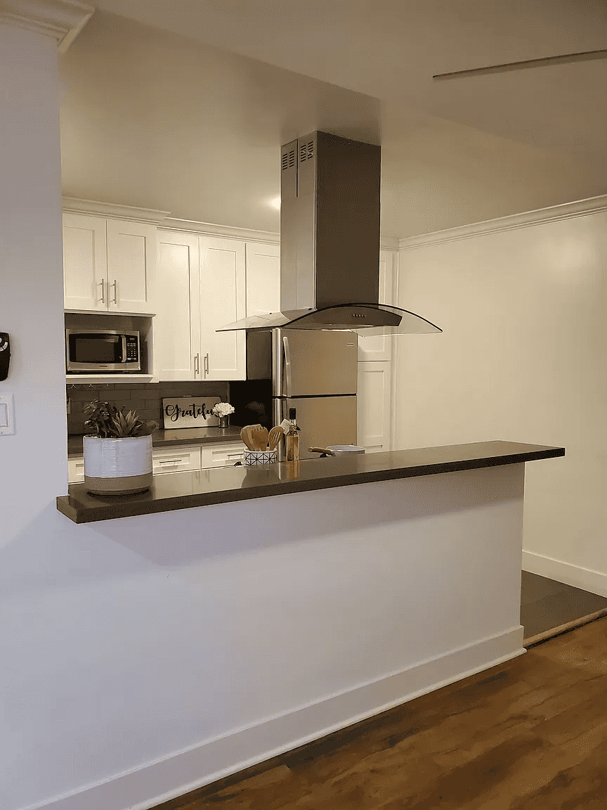 breakfast bar overlooking modern gourmet kitchen