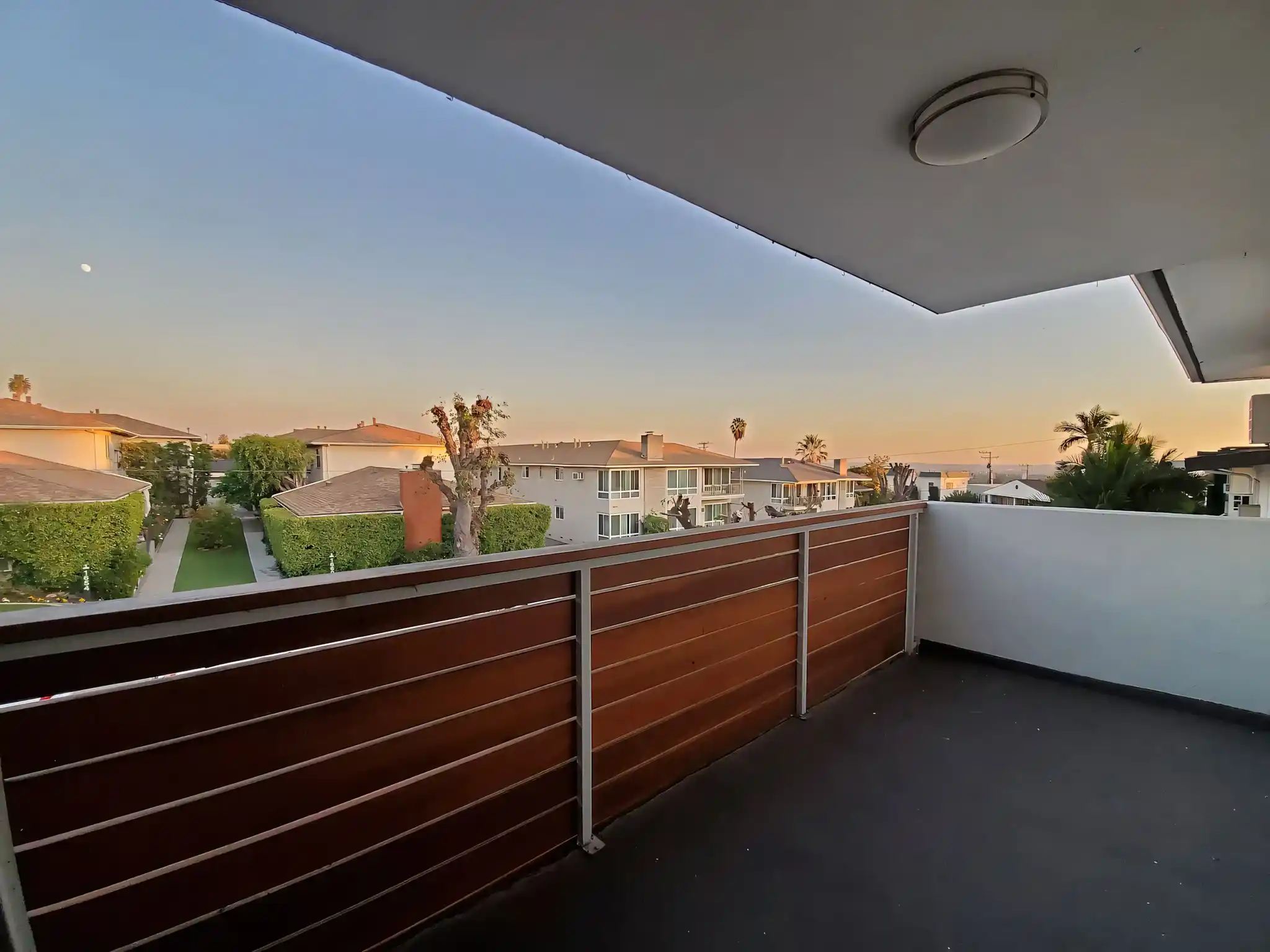 Amberwood Terrace private balcony with neighborhood sunset views