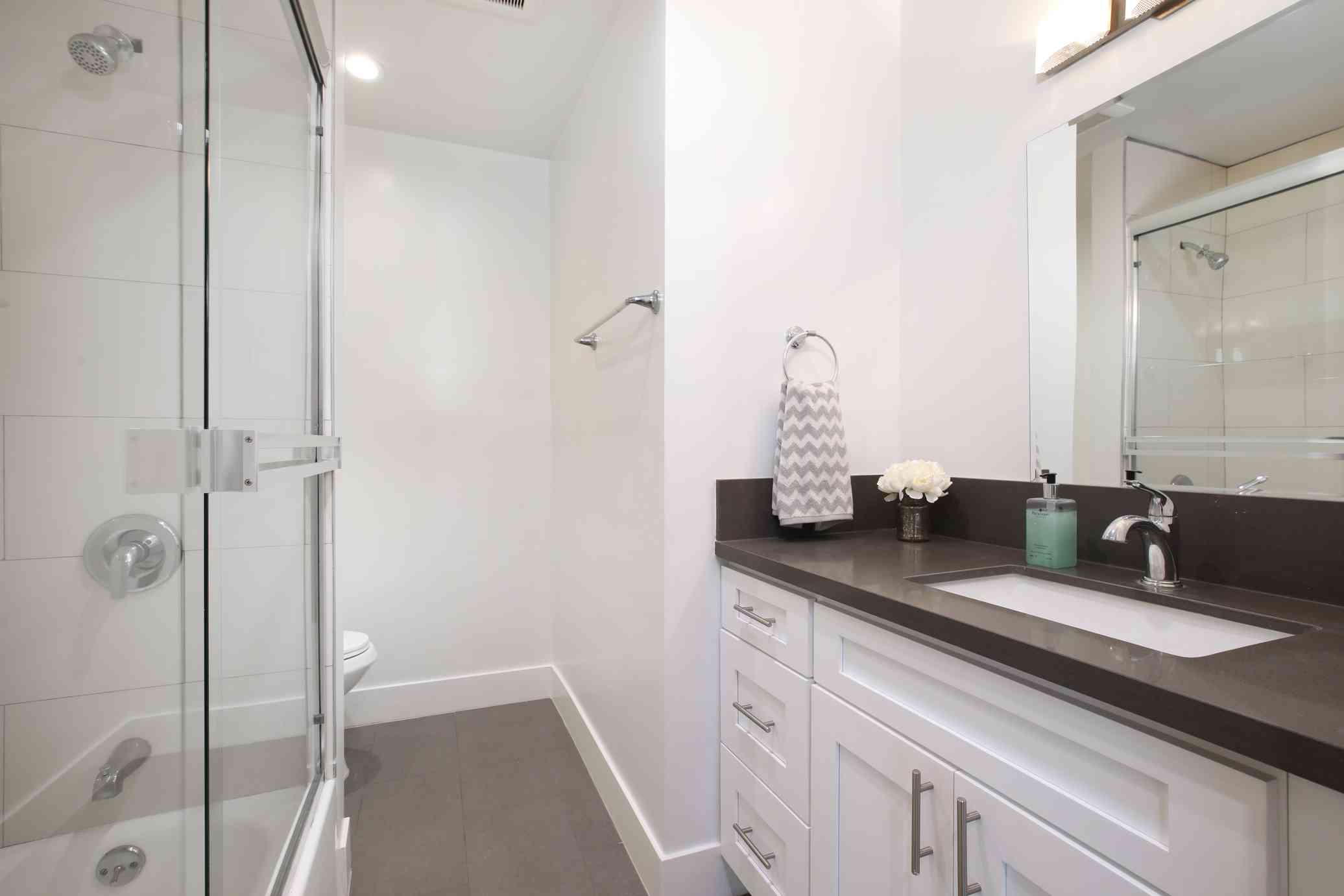 renovated bathroom with glass shower door